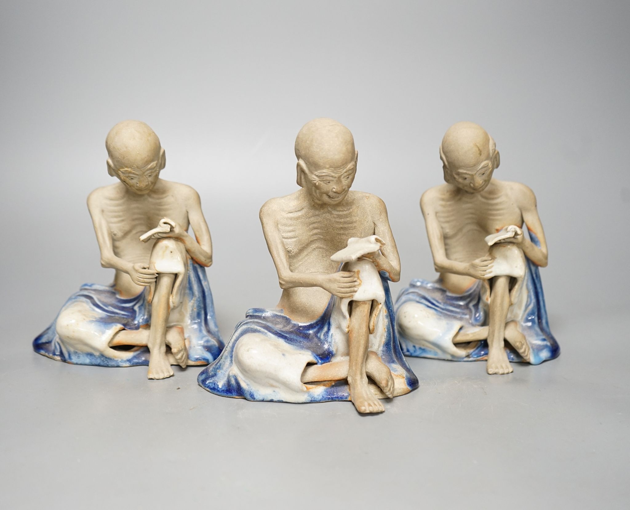 A set of three Shiwan pottery figures of Inohan, 17cm